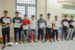 Các đối tượng trong nhóm của Đ.H.K tại cơ quan Công an. (Ảnh: TTXVN phát)