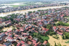 Phường Vân Hà, tỉnh Bắc Ninh bị nước lũ tràn vào gây ngập. (Ảnh: Thái Hùng/TTXVN) 
