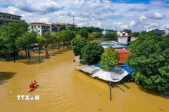 Khu vực trung tâm của tỉnh Thái Nguyên ngập sâu trong nước lũ. (Ảnh: Phạm Tuấn Anh/TTXVN)
