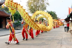 Nghi lễ rước nước tại lễ hội chùa Giám. (Ảnh: Mạnh Tú/TTXVN)