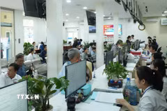 Chính quyền hai cấp đòi hỏi cán bộ phải thay đổi phương pháp làm việc, từ chờ chỉ đạo sang chủ động giải quyết công việc. (Ảnh: Hữu Duyên/TTXVN)