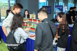 Song song với các phiên tham luận học thuật, Hội thảo ME.AI25 còn có khu vực triển lãm các sản phẩm, mô hình, giải pháp ứng dụng công nghệ và trí tuệ nhân tạo trong lĩnh vực truyền thông và giáo dục. (Ảnh: CTV/Vietnam+)