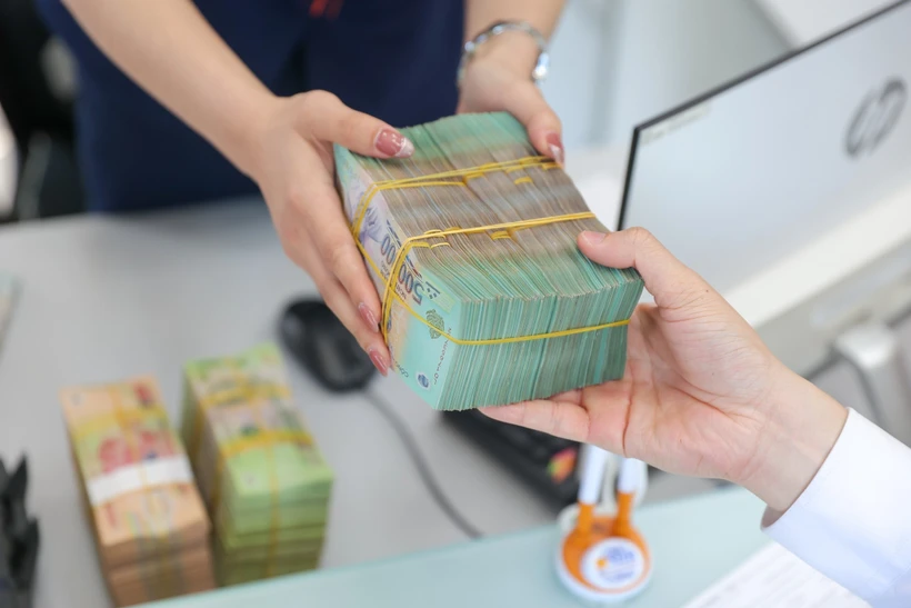 Sửa Luật Các tổ chức tín dụng: Tăng quyền xử lý nợ xấu và sửa quy định cho vay đặc biệt lãi suất 0%. (Ảnh: Vietnam+)