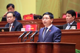 Đồng chí Nguyễn Văn Thắng, Ủy viên Trung ương Đảng, Bí thư Đảng ủy, Bộ trưởng Bộ Tài chính, trình bày tham luận “Hoàn thiện thể chế, pháp luật về huy động, sử dụng nguồn lực tài chính đáp ứng yêu cầu phát triển đất nước nhanh và bền vững”. (Ảnh: TTXVN)