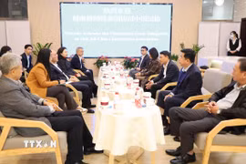 Buổi làm việc giữa Hội Nhà báo Việt Nam và Hội Nhà báo toàn Trung Quốc. (Ảnh: Quang Hưng/TTXVN)