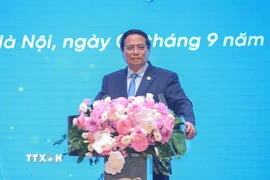 Thủ tướng Phạm Minh Chính phát biểu tại Lễ kỷ niệm 80 năm ngày truyền thống Tập đoàn Bưu chính Viễn thông Việt Nam (VNPT). (Ảnh: Dương Giang/TTXVN)