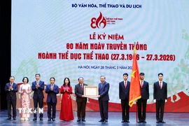 Tổng Bí thư Tô Lâm trao Huân chương Lao động hạng Nhất tặng Cục Thể dục Thể thao Việt Nam (Bộ Văn hóa, Thể thao và Du lịch). (Ảnh: Thống Nhất/TTXVN)