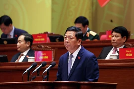 Đồng chí Trần Hồng Minh, Ủy viên Trung ương Đảng, Bí thư Đảng ủy, Bộ trưởng Bộ Xây dựng, tham luận về vấn đề “Đột phá mạnh mẽ phát triển kết cấu hạ tầng trong kỷ nguyên mới”. (Ảnh: TTXVN)