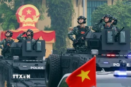 Khối xe đặc chủng của lực lượng Công an tham gia diễu hành tại buổi lễ. (Ảnh: Phạm Kiên/TTXVN)