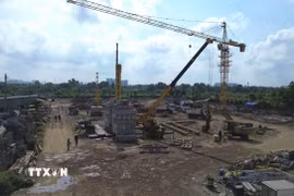 Dự án nhà ở xã hội Lê Thành Tân Kiên (xã Tân Nhựt, TP. Hồ Chí Minh) bên cạnh Đại lộ Võ Văn Kiệt. (Ảnh: Thanh Vũ/TTXVN