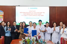 Ký kết hợp tác giữa hai bên. (Ảnh: PV/Vietnam+)