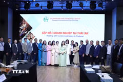 Đoàn công tác của Thành phố Cần Thơ cùng các doanh nghiệp chụp ảnh lưu niệm tại Hội nghị. (Ảnh: Đỗ Sinh/TTXVN)