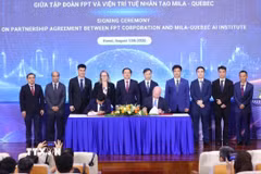 Phó Thủ tướng Hồ Quốc Dũng cùng các đại biểu chứng kiến Lễ ký kết Thỏa thuận hợp tác giữa Tập đoàn FPT và Viện Nghiên cứu Trí tuệ nhân tạo Mila của Canada. (Ảnh: Văn Điệp/TTXVN)