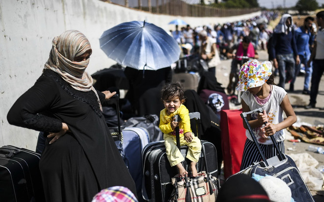 Thủ tướng Đức Merkel bảo vệ chính sách đối với người tị nạn ảnh 1