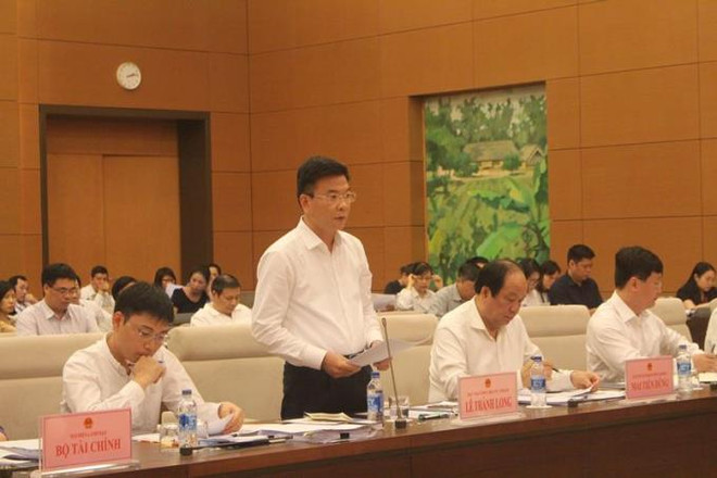 Bộ trưởng Bộ Tư pháp Lê Thành Long giải trình trước Ủy ban Pháp luật của Quốc hội. (Nguồn: moj.gov.vn) Bộ Tư pháp: Không nên rút ngắn thời gian thẩm định dự án luật ảnh 1