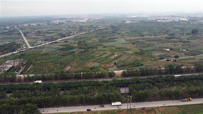Tuyến Vành đai 4 qua Đại lộ Thăng Long trên địa bàn xã Song Phương, huyện Hoài Đức (Hà Nội). (Ảnh: Huy Hùng/TTXVN) Vành đai 4-Vùng Thủ đô: Cơ bản giải phóng mặt bằng dự án tái định cư ảnh 1