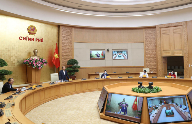 Thủ tướng Nguyễn Xuân Phúc phát biểu. (Ảnh: Thống Nhất/TTXVN) Hà Nội cần quyết liệt, chủ động triển khai biện pháp phục hồi kinh tế ảnh 3