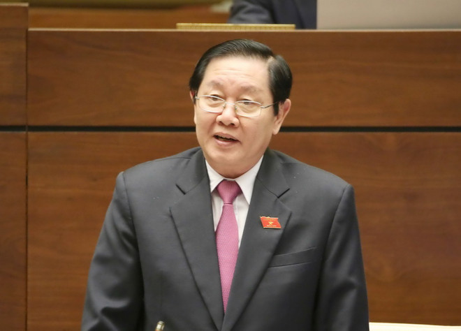 Bộ trưởng Bộ Nội vụ Lê Vĩnh Tân trả lời chất vấn. (Ảnh: Phương Hoa/TTXVN) Bộ trưởng Nội vụ: Không bổ sung phụ cấp đặc thù theo ngành nghề ảnh 1