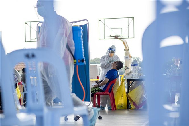 COVID-19: Malaysia lần đầu ghi nhận hơn 7.000 ca mắc mới một ngày ảnh 1