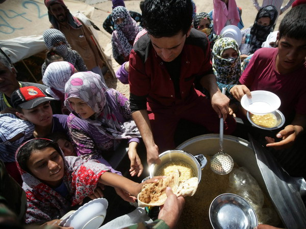 Chính phủ Anh tiếp nhận nhóm người tị nạn Syria đầu tiên ảnh 1