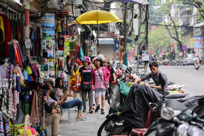 Ảnh minh họa. (Nguồn: Vietnam+) Nghịch lý nhiều hộ kinh doanh chưa muốn lên doanh nghiệp ảnh 1