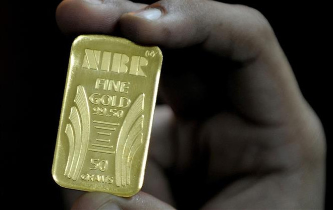 Giá vàng châu Á giảm 1% trong phiên giao dịch chiều 28/3 ảnh 1