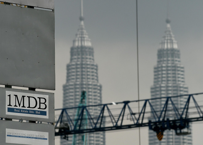 Vụ 1MDB: Malaysia yêu cầu em trai cựu Thủ tướng Najib trả lại tiền ảnh 1