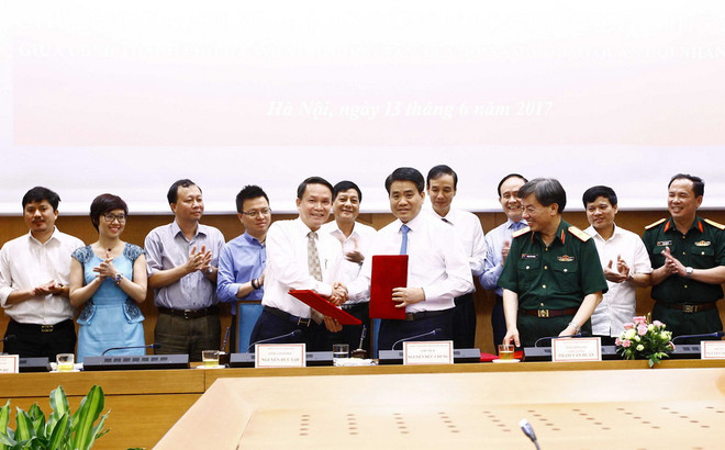 Hà Nội và Thông tấn xã Việt Nam ký kết chương trình phối hợp công tác ảnh 1