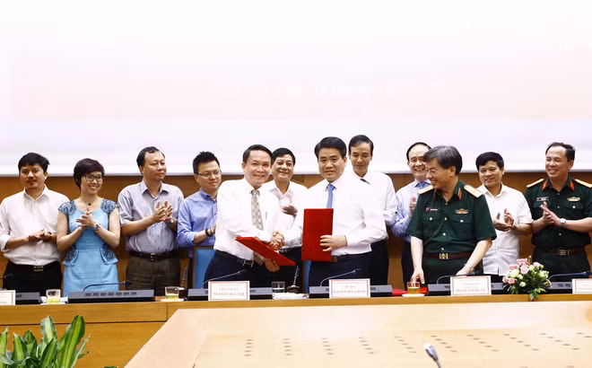 Hà Nội và Thông tấn xã Việt Nam ký kết chương trình phối hợp công tác ảnh 1