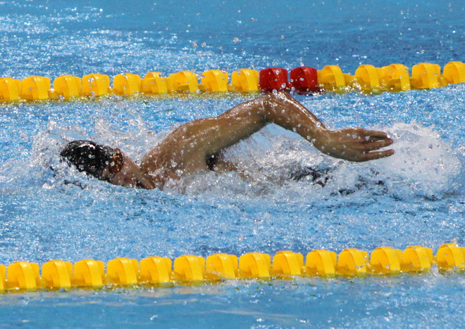 Võ Thanh Tùng đã lập cú "hat-trick" huy chương vàng tại Asian Para Games II. (Ảnh: Ngọc Trường/TTXVN) Asian Para Games: Võ Thanh Tùng lập "hat-trick" huy chương vàng ảnh 1