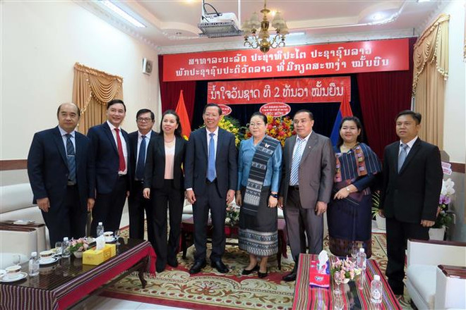 Lãnh đạo Thành phố Hồ Chí Minh chúc mừng Quốc khánh Lào ảnh 2