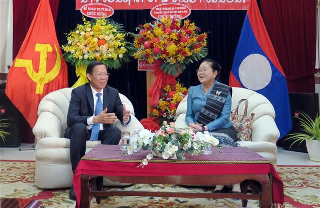 Lãnh đạo Thành phố Hồ Chí Minh chúc mừng Quốc khánh Lào ảnh 1