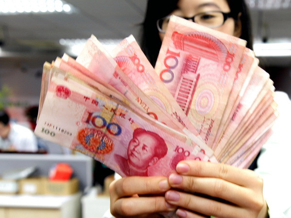 Kiểm đồng Nhân dân tệ. (Nguồn: EPA/TTXVN) Ngân hàng Trung Quốc bơm khoảng 50 tỷ USD vào thị trường ảnh 1
