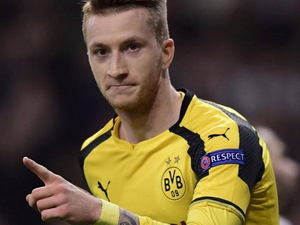 Marco Reus ghi bàn gỡ hòa 2-2 trong trận gặp Real. (Ảnh: AFP) "Chấm điểm" thành tích của Bundesliga sau vòng bảng Champions League ảnh 2