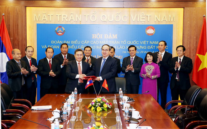 Hai nước Việt Nam, Lào tăng cường hợp tác công tác mặt trận ảnh 1