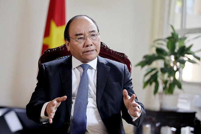 Thủ tướng Chính phủ Nguyễn Xuân Phúc. (Nguồn: Bloomberg) Thủ tướng Nguyễn Xuân Phúc trả lời phỏng vấn báo The Straits Times ảnh 1