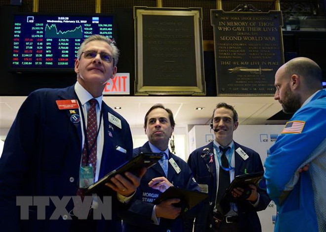 Mỹ: Chỉ số chứng khoán Nasdaq lần đầu tiên vượt ngưỡng 9.000 điểm ảnh 1