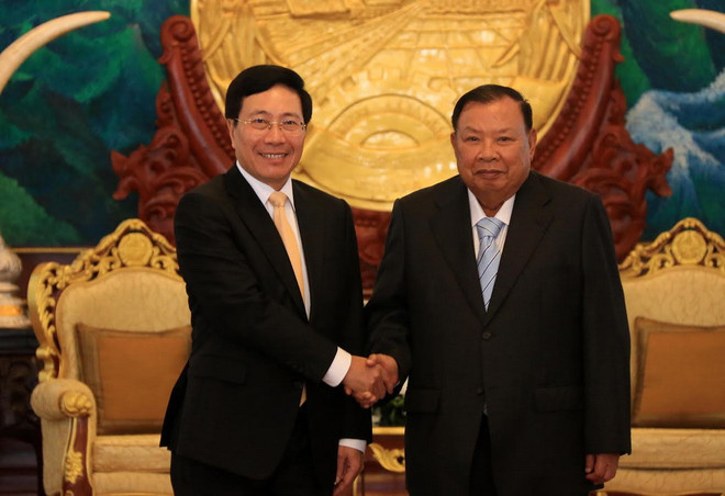 Phó Thủ tướng, Bộ trưởng Ngoại giao Phạm Bình Minh đến chào Tổng Bí thư, Chủ tịch nước Lào Bounnhang Volachith. (Ảnh: Phạm Kiên/TTXVN) Phó Thủ tướng Phạm Bình Minh thăm và làm việc tại Lào ảnh 1