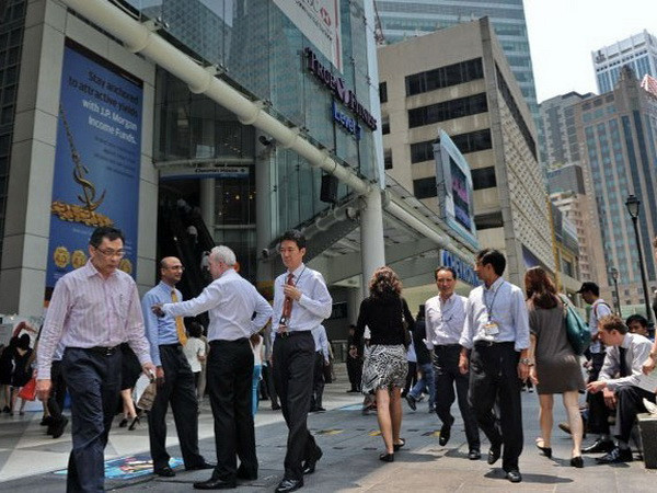 Singapore sẽ thắt chặt thị trường lao động trong năm 2015 ảnh 1