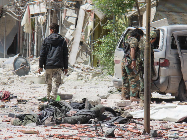 Phiến quân IS hành quyết ít nhất 26 người dân ở Syria ảnh 1