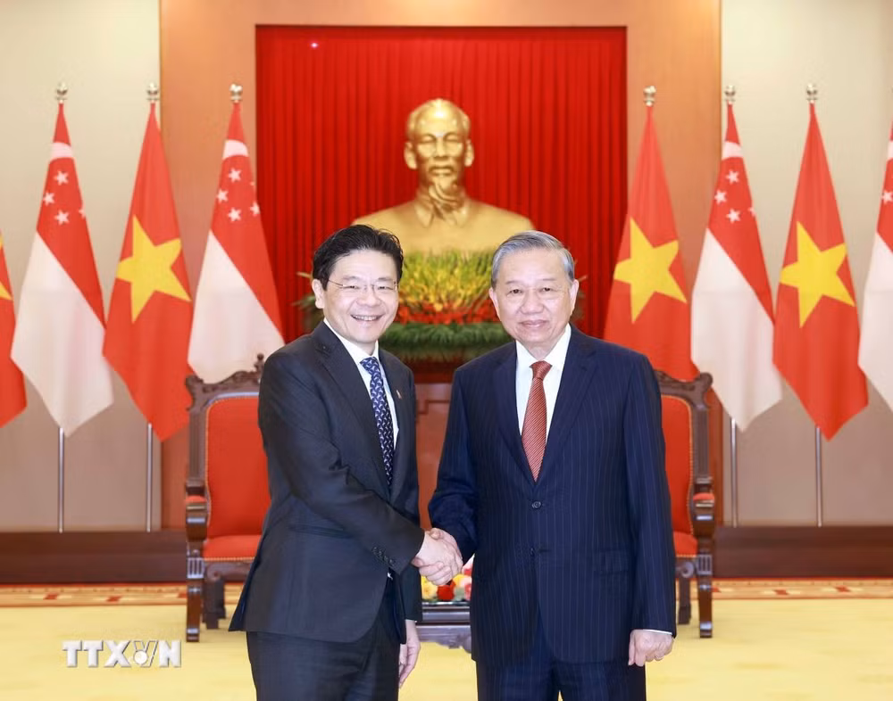 ttxvn-tong-bi-thu-to-lam-tiep-thu-tuong-singapore-2603-2.jpg