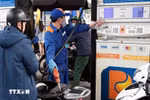Khách hàng mua xăng, dầu tại một cửa hàng của Petrolimex trên địa bàn Hà Nội. (Ảnh: Trần Việt/TTXVN)
