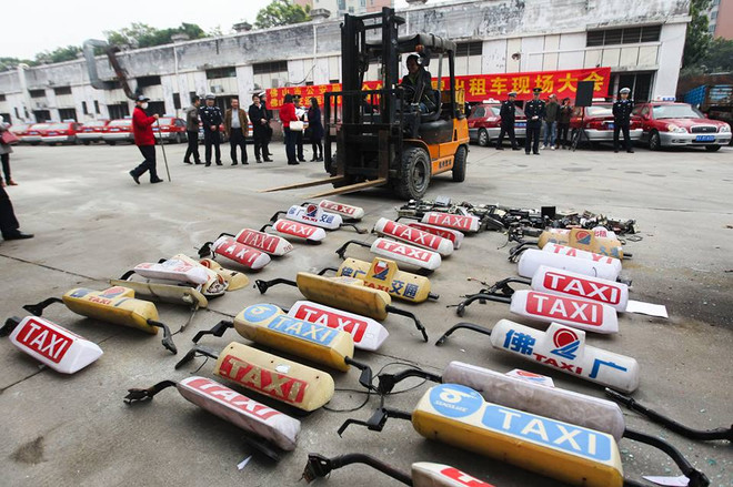 Trung Quốc thu giữ và đã đập nát hơn 100 chiếc xe taxi giả ảnh 7