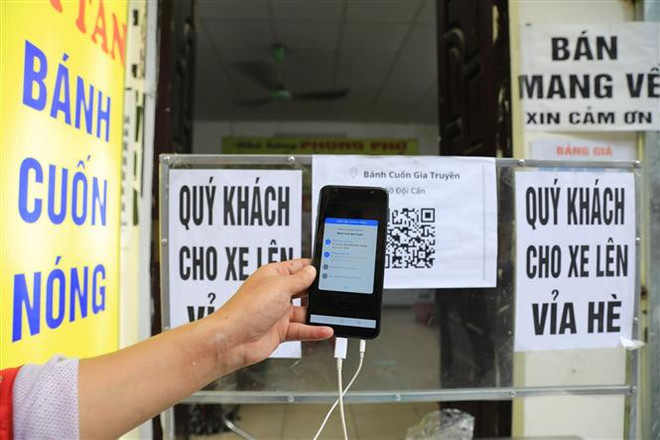(Ảnh minh họa: Thành Đạt/TTXVN) Doanh nghiệp phân phối sản phẩm ICT hưởng lợi từ xu hướng số hóa ảnh 2