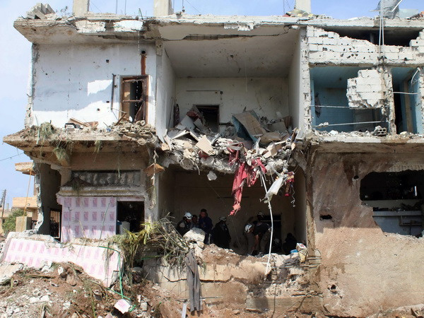 Syria: Liên minh do Mỹ dẫn đầu không kích kho vũ khí hóa học của IS ảnh 1