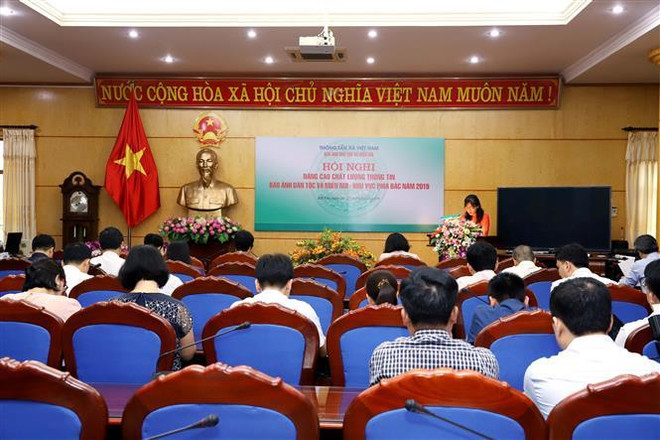 Quang cảnh hội nghị. (Ảnh: TTXVN) Tiếp tục nâng cao chất lượng thông tin Báo ảnh Dân tộc và Miền núi ảnh 1