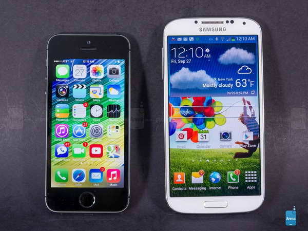 iPhone 5s và Galaxy S5. (Nguồn: Arena) Người dùng thích đổi điện thoại cũ lấy S5 hơn iPhone 5s ảnh 1