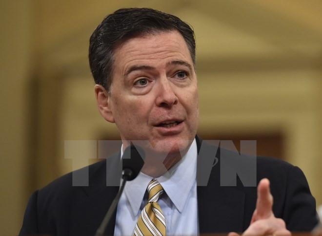 Cựu Giám đốc Cục Điều tra Liên bang James Comey. (Nguồn: AFP/TTXVN) Cựu Giám đốc FBI điều trần tại Ủy ban Tình báo Thượng viện Mỹ ảnh 1