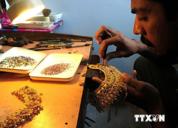 Ảnh minh họa. (Nguồn: AFP/TTXVN) Giá vàng châu Á xuống mức thấp nhất trong gần hai tuần ảnh 1