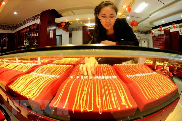 Vàng thế giới tăng giá trước thềm hội nghị thượng đỉnh Mỹ-Triều ảnh 1